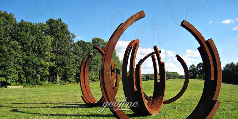 corten steel abstract sculpture in lawn