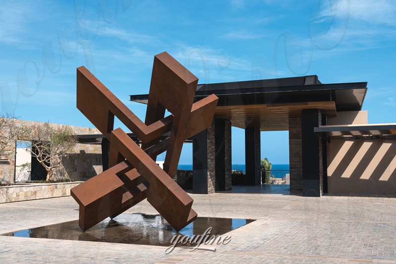 corten steel abstract sculpture in yard