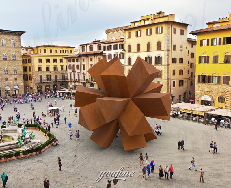 large corten steel sculpture in square